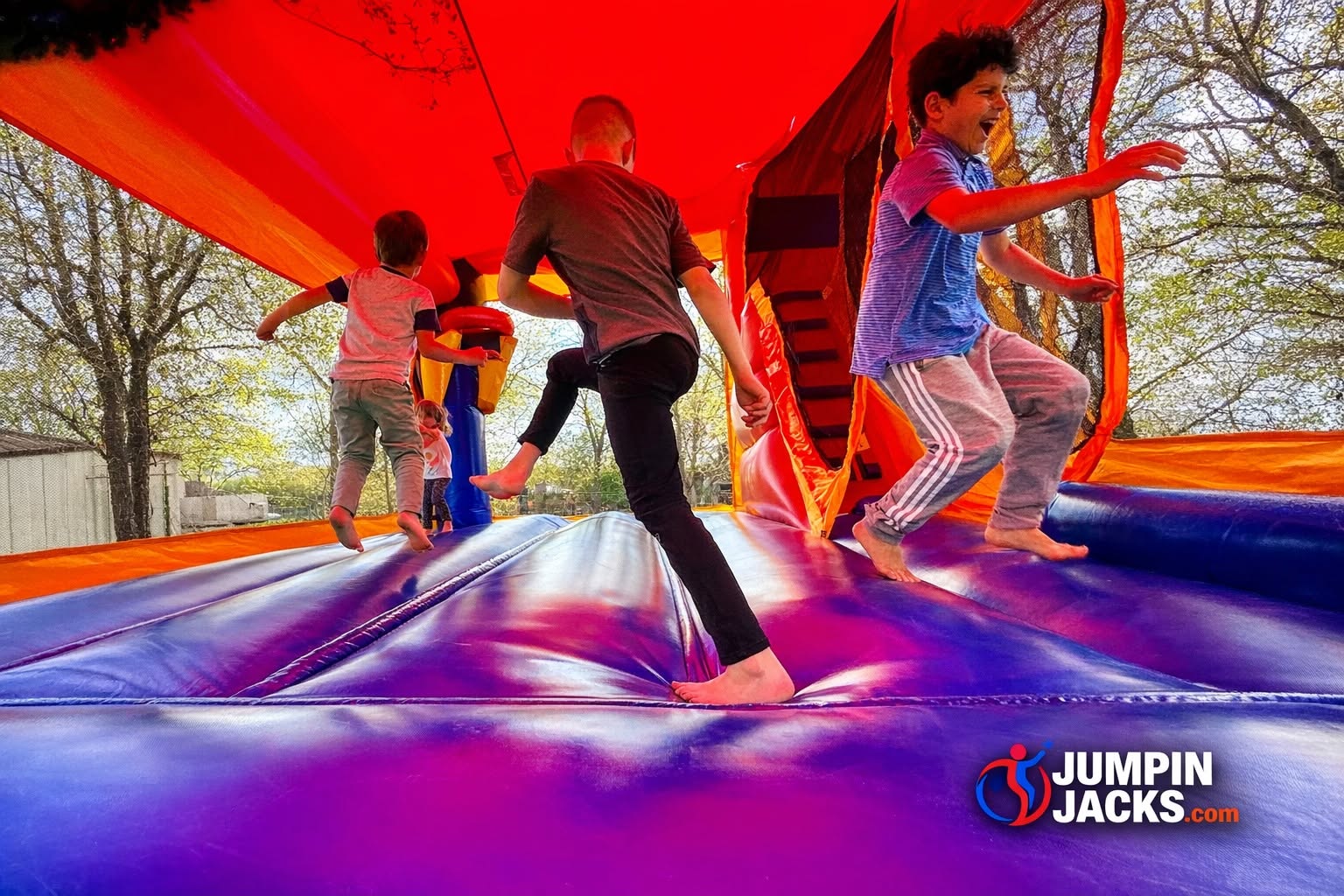 Kids having fun inside a Jumpin' Jacks bounce house rental in Santa Rosa California
